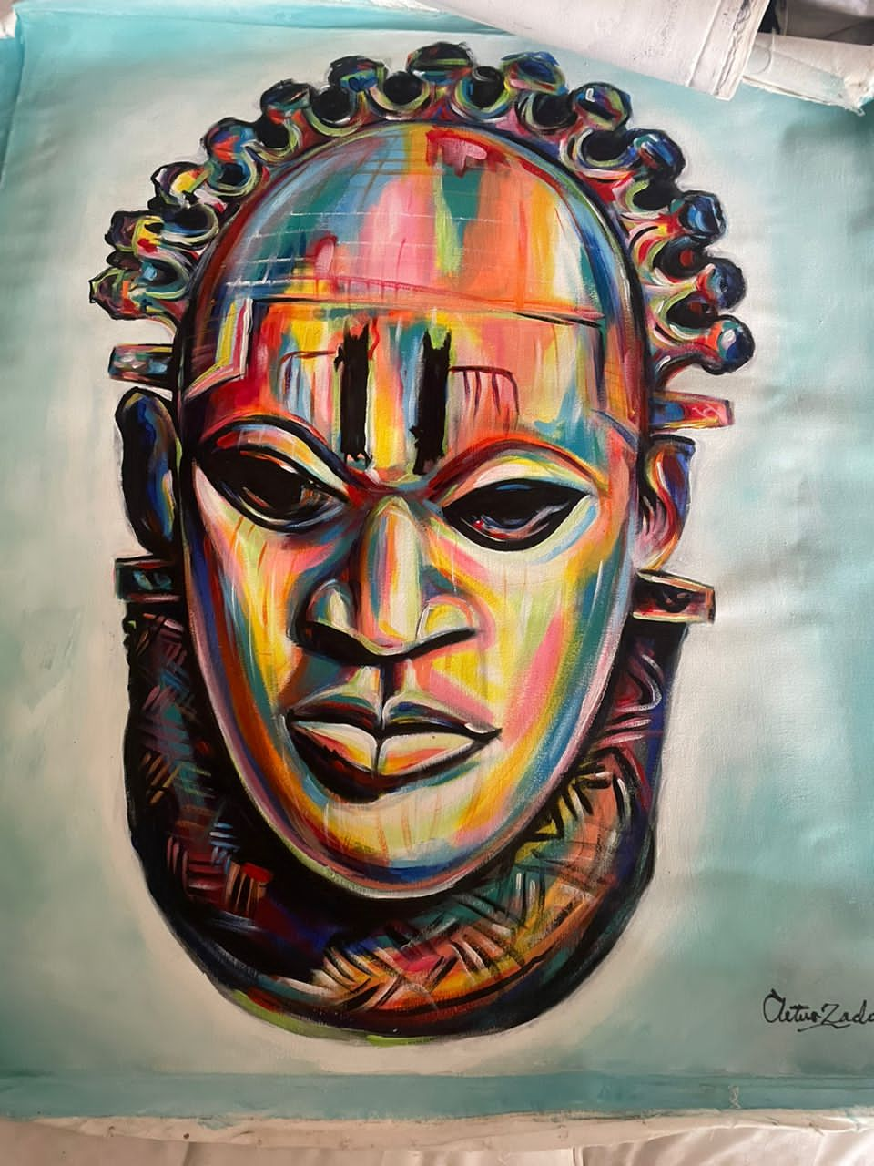 A painting of a Idia's mask showcasing intricate details and vibrant colors in a serene setting. 
